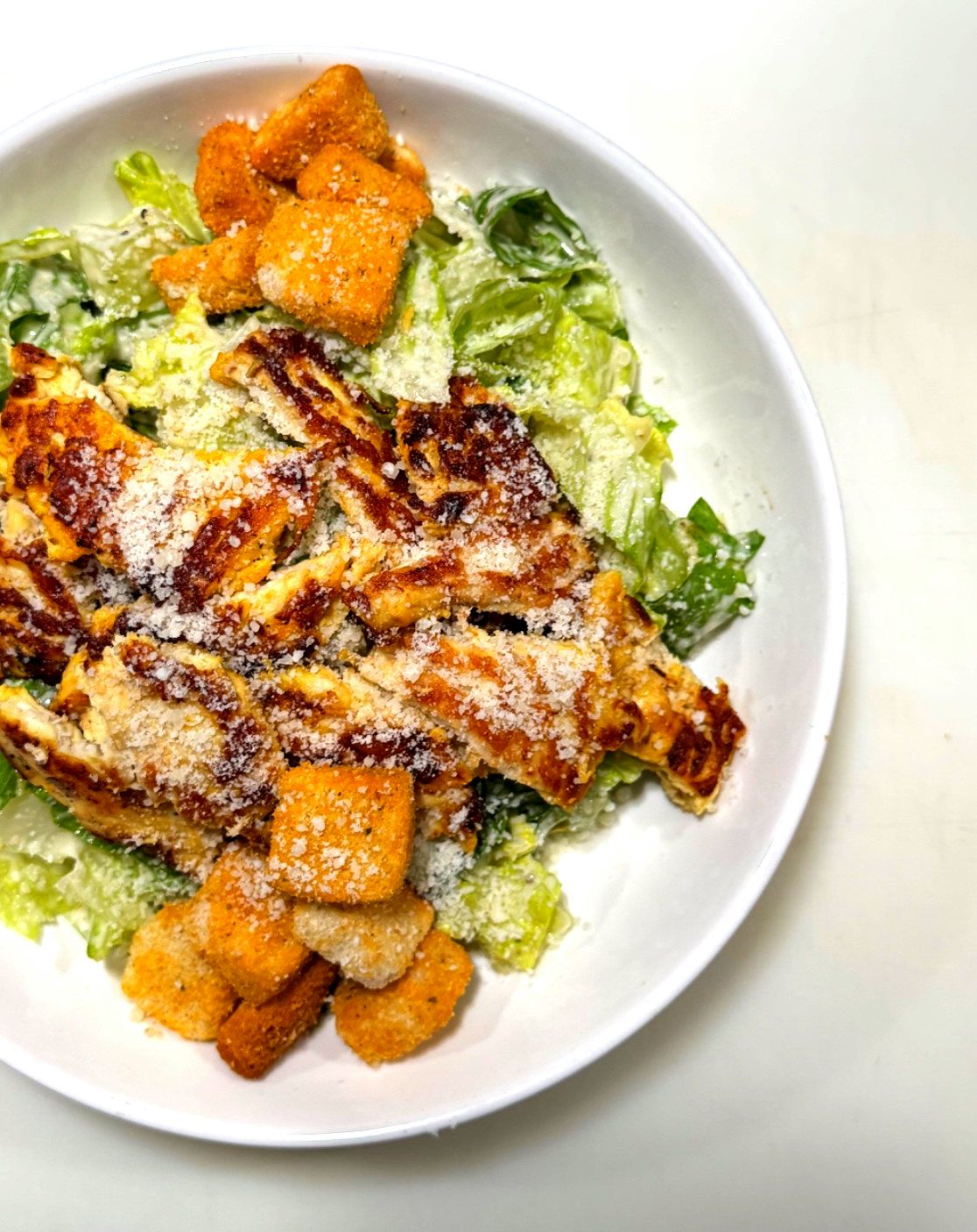 Chicken Caesar salad with grilled chicken, parmesan and croutons